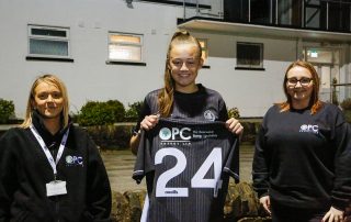 Bumblebee Energy staff with Partick Thistle Womens FC player showing shirt sponsorship
